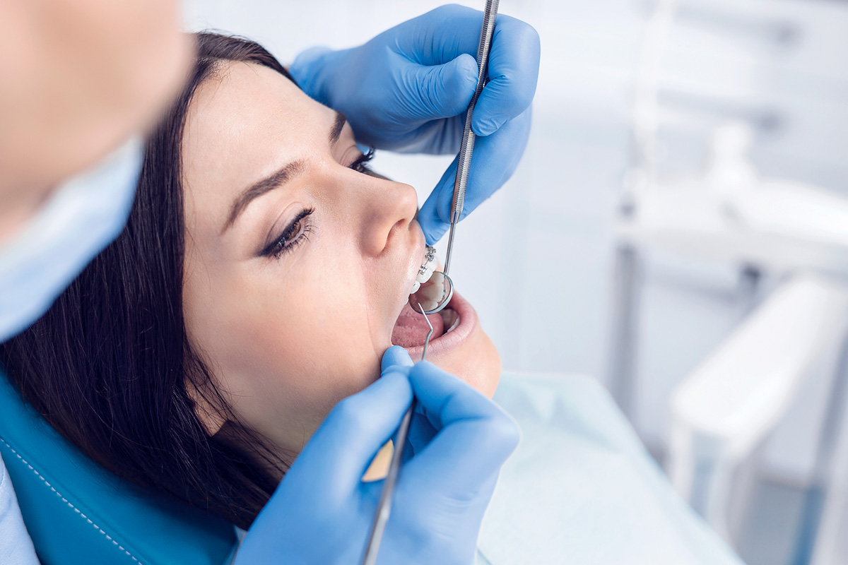 a lady getting braces treatment