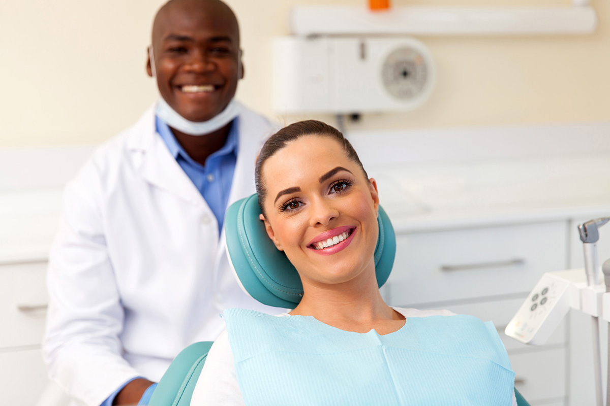 a lady is smiling after getting dental treatment