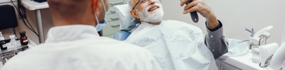 an old man is having dental veneers treatment